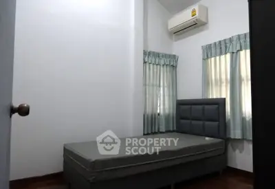 Cozy bedroom with air conditioning and natural light