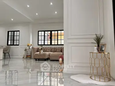 Luxurious living room with elegant decor and plush seating in a modern home.