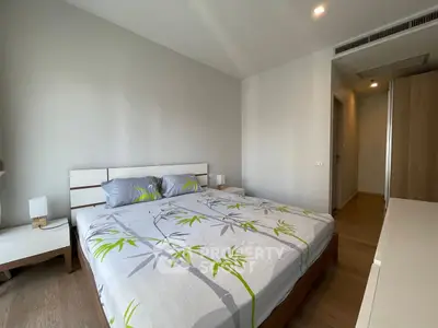 Modern bedroom with stylish decor and ample natural light