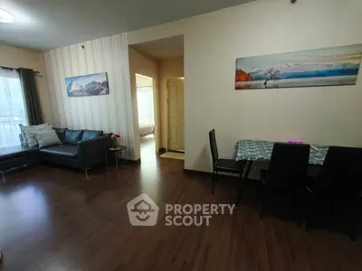 Spacious living room with modern decor and dining area, perfect for family gatherings.