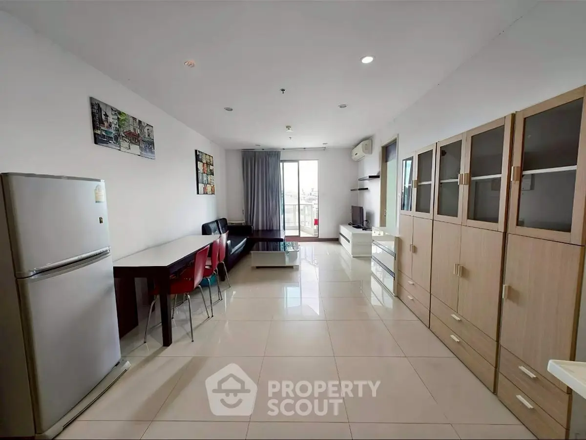 Spacious modern living room with dining area and large windows