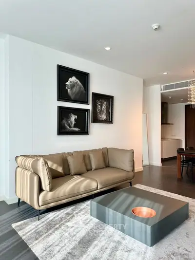 Modern living room with stylish sofa and artistic wall decor