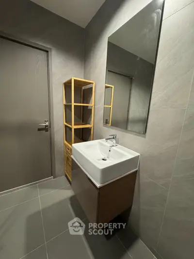 Modern bathroom with sleek sink and stylish shelving unit