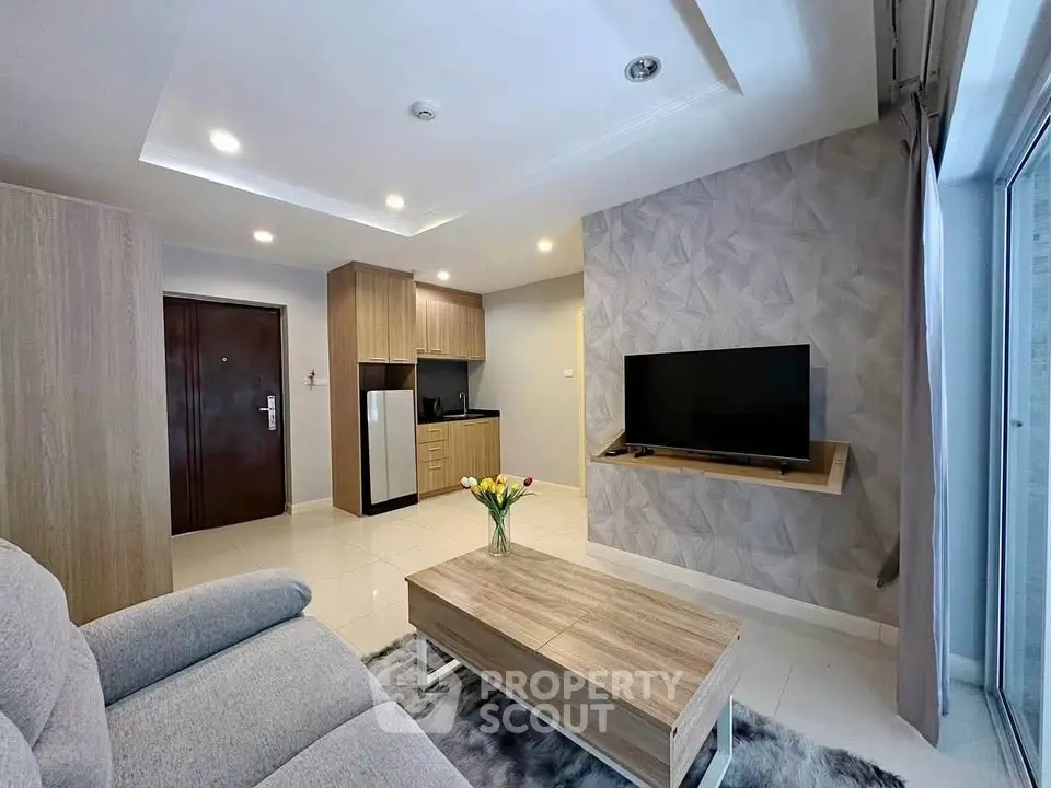 Modern living room with stylish decor and open kitchen layout