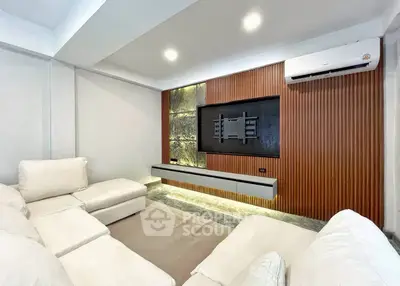 Modern living room with sleek design and cozy white sectional sofa