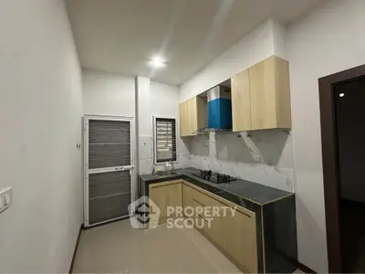 Modern kitchen with sleek cabinetry and gas stove in a stylish apartment