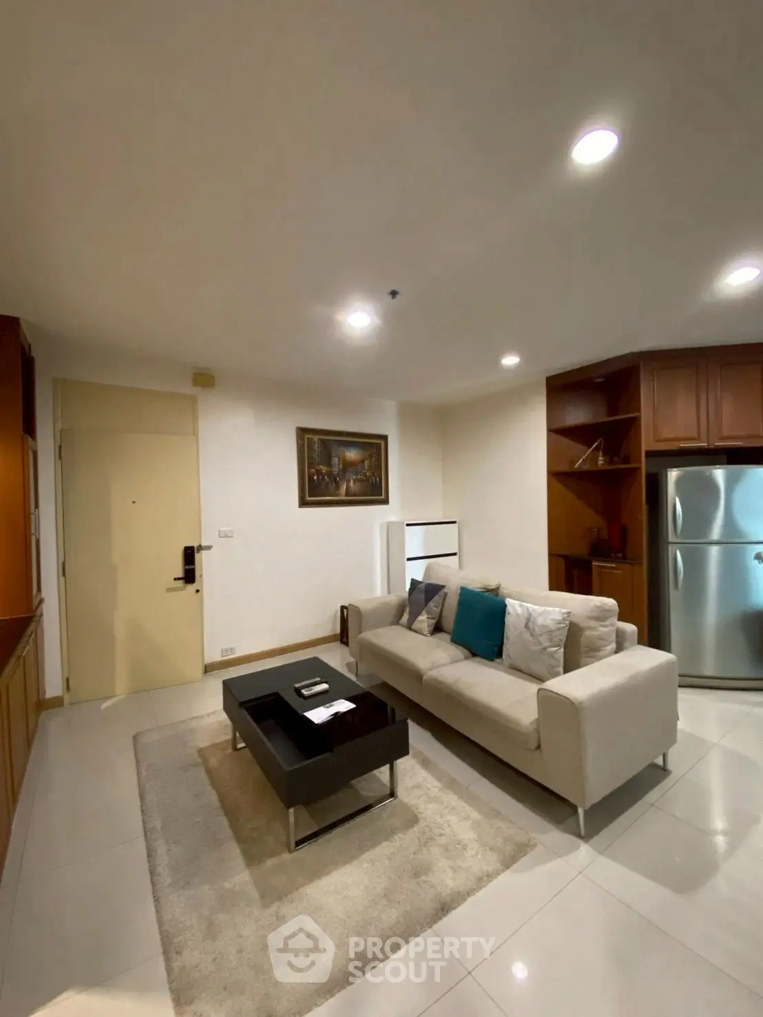 Modern living room with cozy sofa and stylish decor in a contemporary apartment.