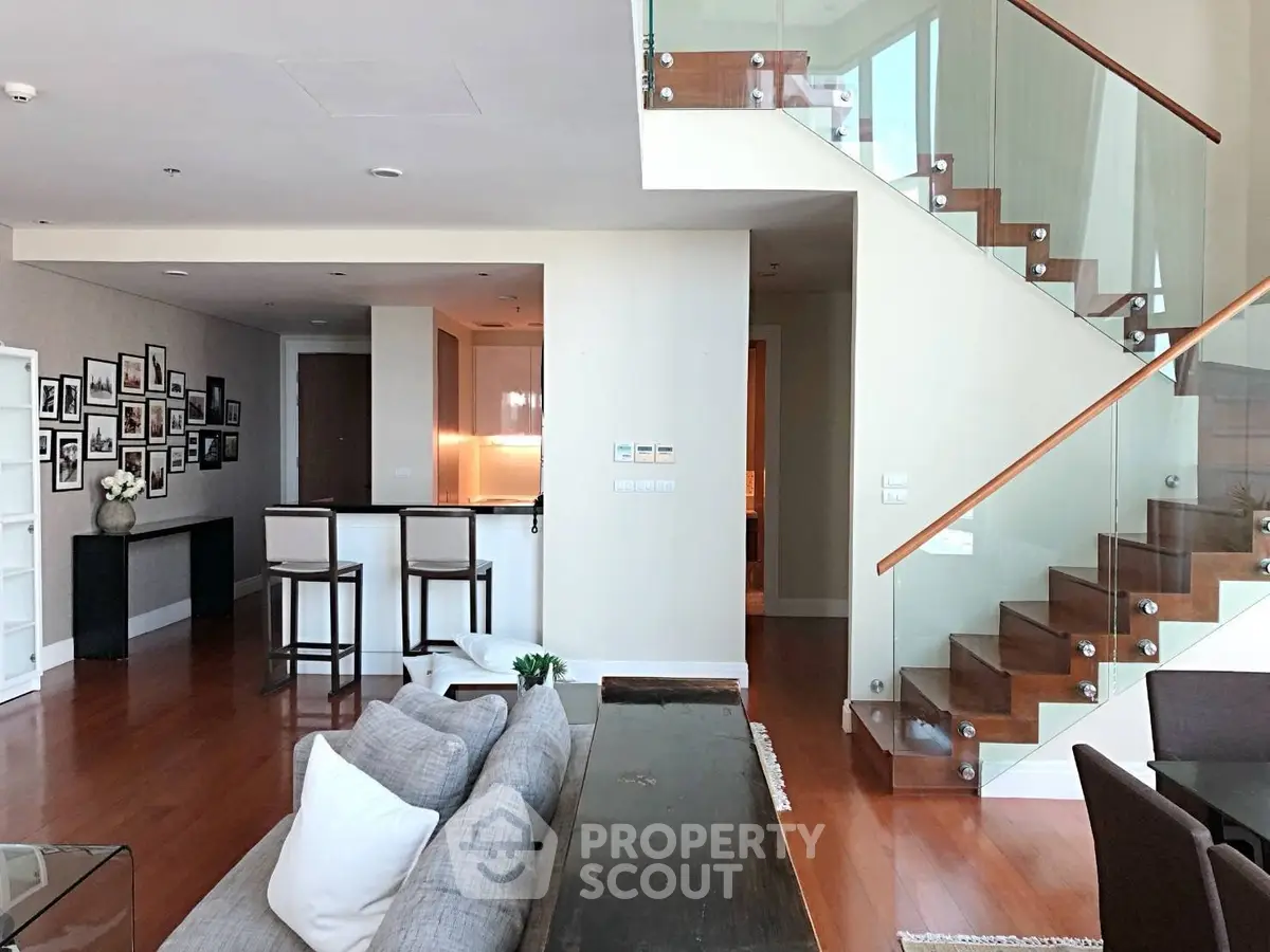 Luxurious duplex living room with modern staircase and stylish decor