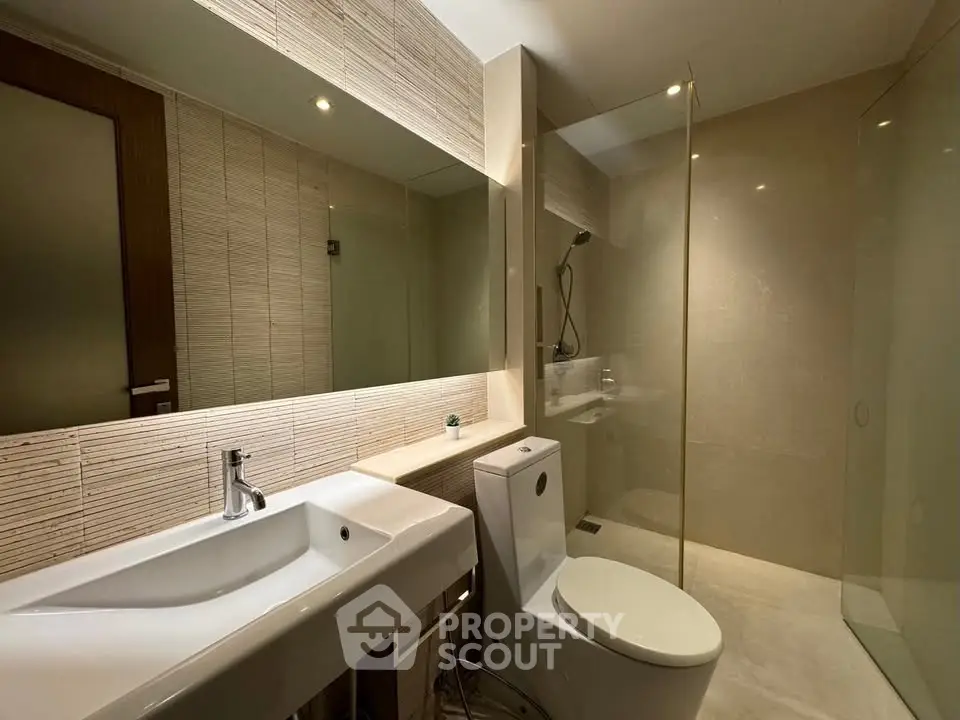 Modern bathroom with sleek design and glass shower enclosure