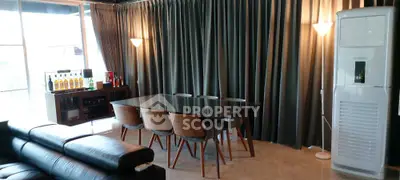 Stylish dining area with modern furniture and elegant lighting in a luxurious apartment.