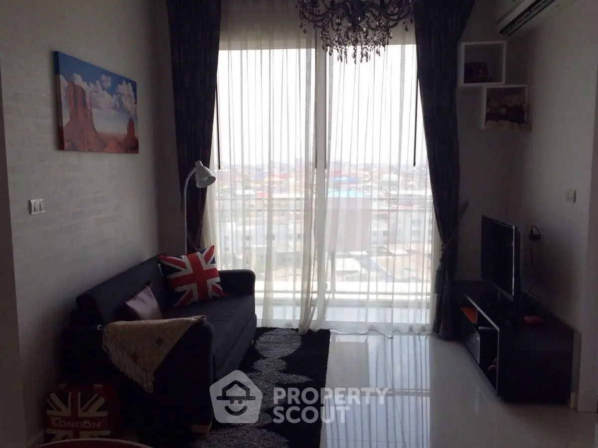 Stylish living room with city view, modern decor, and large windows for natural light.