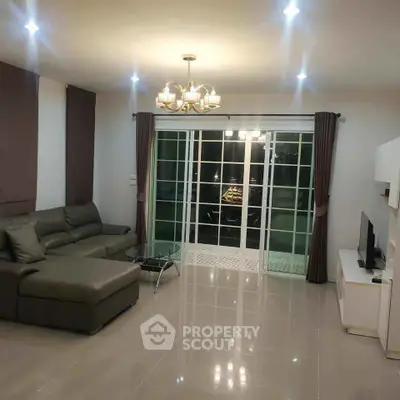 Spacious modern living room with sleek furniture and elegant lighting