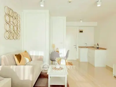 Bright and modern living room with stylish decor and cozy seating area.