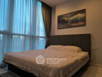 Modern bedroom with large windows and elegant decor