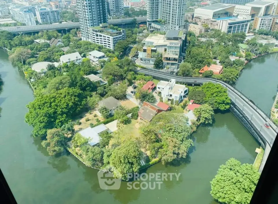 Stunning aerial view of lush green island surrounded by water and urban skyline