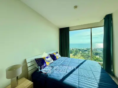 Bright bedroom with ocean view and modern decor