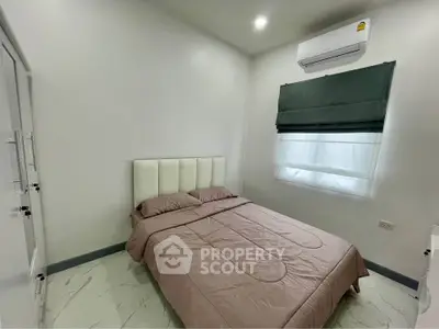 Cozy bedroom with modern air conditioning and elegant decor
