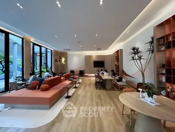 Spacious modern living room with elegant decor and large windows