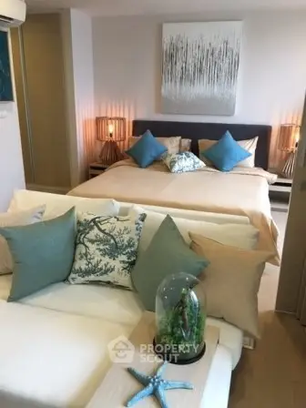 Luxurious bedroom with elegant decor and cozy seating area, perfect for relaxation.