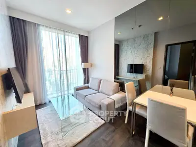 Modern living room with glass table and city view