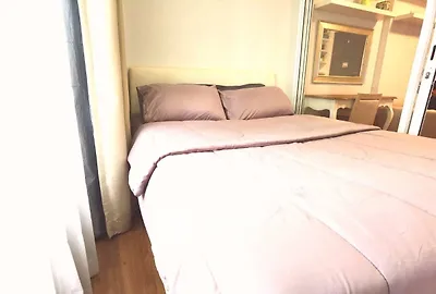 Cozy bedroom with soft lighting and elegant decor, perfect for relaxation.