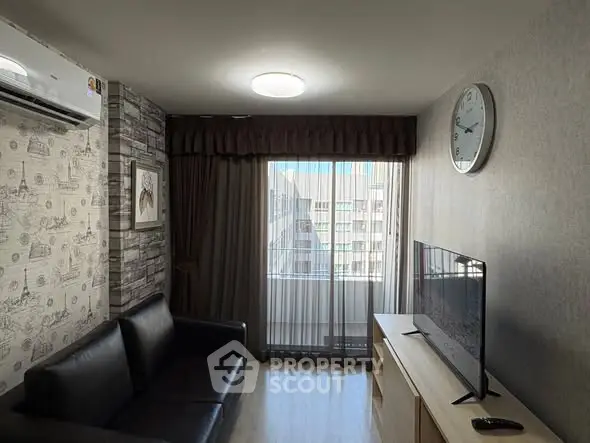 Modern living room with sleek black sofa, wall-mounted TV, and large window with city view.