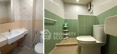 Spacious bathroom with modern fixtures and green-tiled walls.