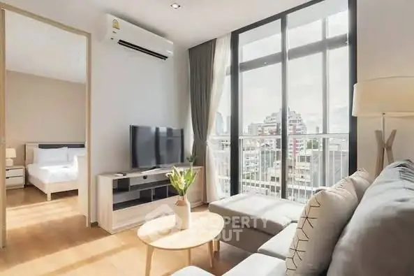 Bright modern living room with city view and stylish furniture