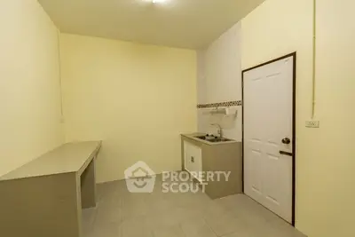 Minimalist kitchen with closed layout and neutral tones