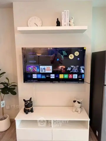 Modern living room with wall-mounted TV and stylish decor