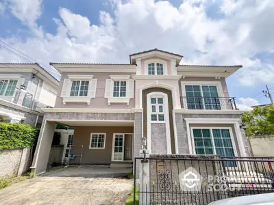 Elegant two-story house with spacious driveway and modern facade