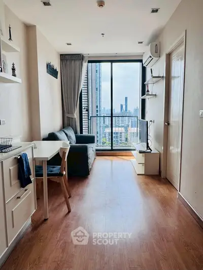 Modern living room with city view, featuring sleek furniture and wooden flooring, perfect for urban living.