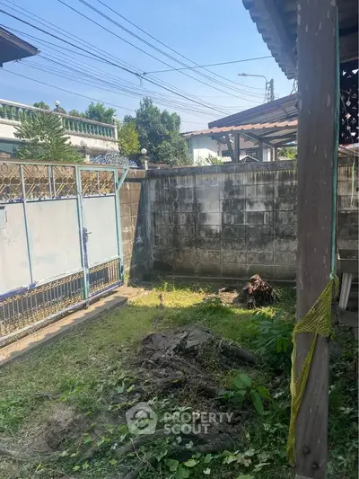 Charming outdoor garden space with potential for landscaping in a residential property.