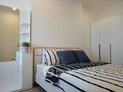 Modern bedroom with stylish decor and ample storage space