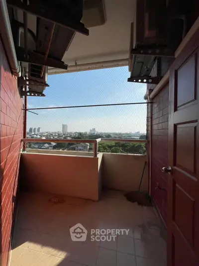 Charming balcony with city view, perfect for relaxation and enjoying the skyline.