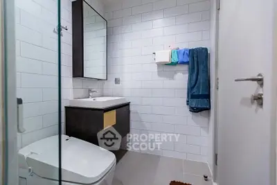 Modern bathroom with sleek fixtures and white subway tiles