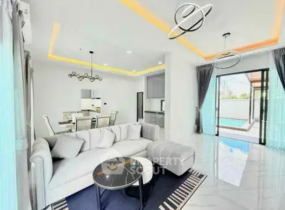 Luxurious modern living room with elegant decor and pool view