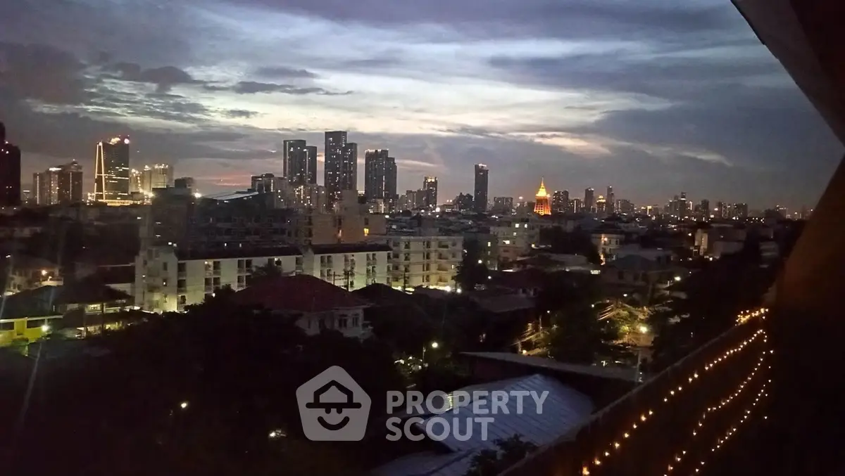 Stunning city skyline view at dusk with twinkling lights and vibrant atmosphere.