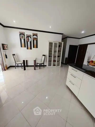Spacious modern living room with elegant dining area and stylish decor