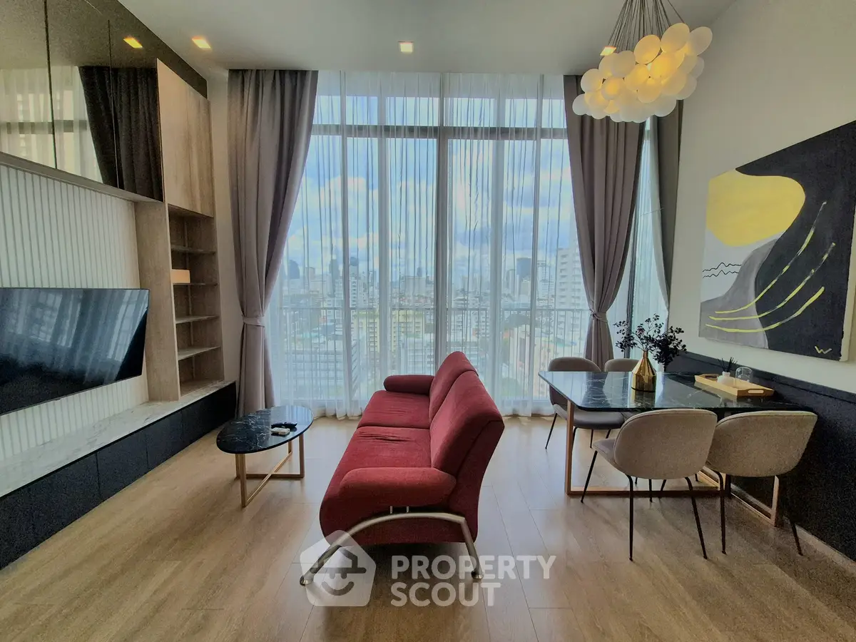 Modern living room with city view, stylish furniture, and elegant lighting