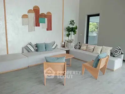 Modern living room with stylish decor and comfortable seating, perfect for relaxation and entertaining.