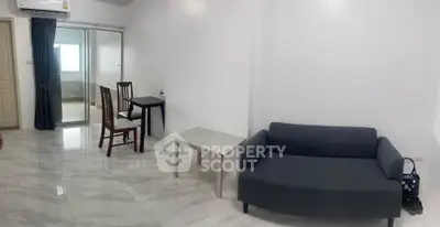 Modern living room with sleek marble flooring and minimalist furniture design