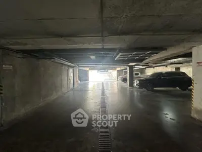 Spacious underground parking area with ample lighting and secure environment.