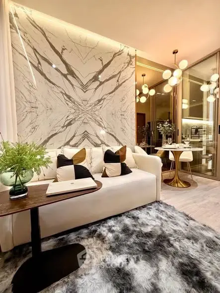 Luxurious modern living room with elegant marble wall and plush decor