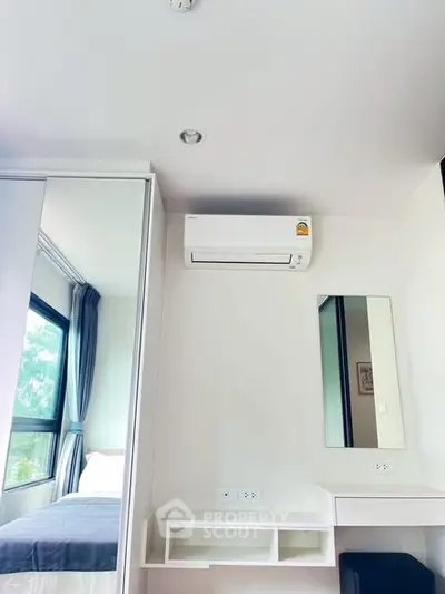 Modern bedroom with air conditioning and large window view