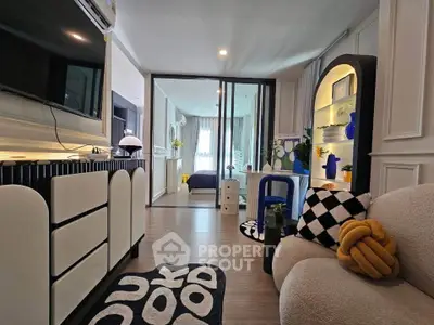 Stylish modern living room with chic decor and open view into a cozy bedroom, perfect for urban living.