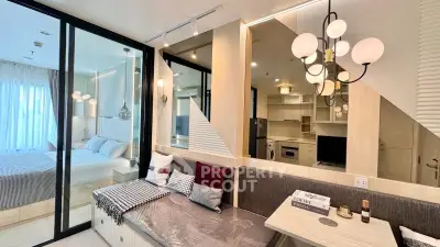Modern open-plan living room with stylish decor and cozy seating area