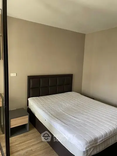 Cozy bedroom with modern design and comfortable bed in a stylish apartment.