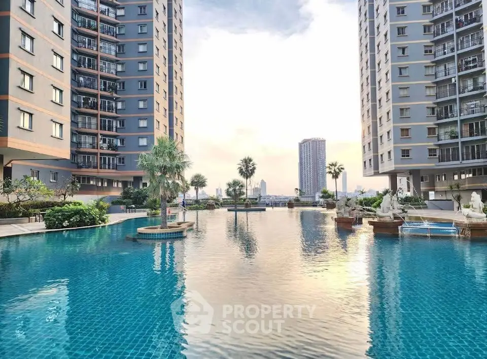 Luxurious residential complex with stunning pool and skyline view
