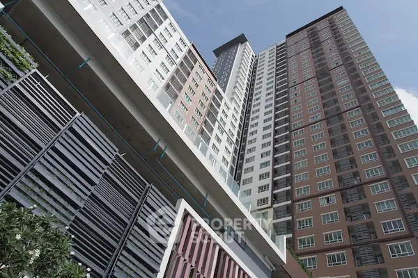 Modern high-rise residential building with sleek architectural design and urban appeal.